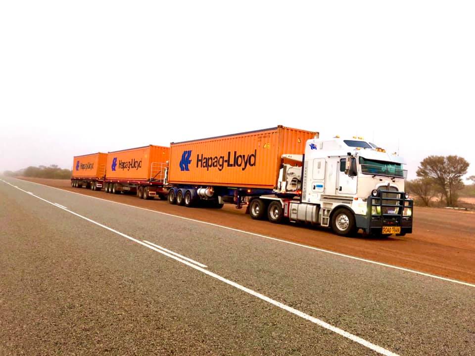 Shipping Container Freight Transport Across Western Australia AWH road train transporting shipping containers through regional Western Australia