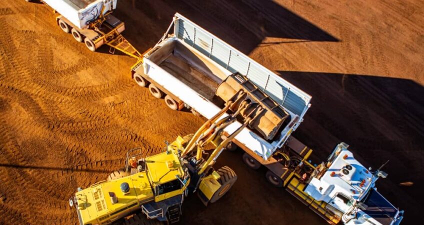 Loader loading semitrailer.