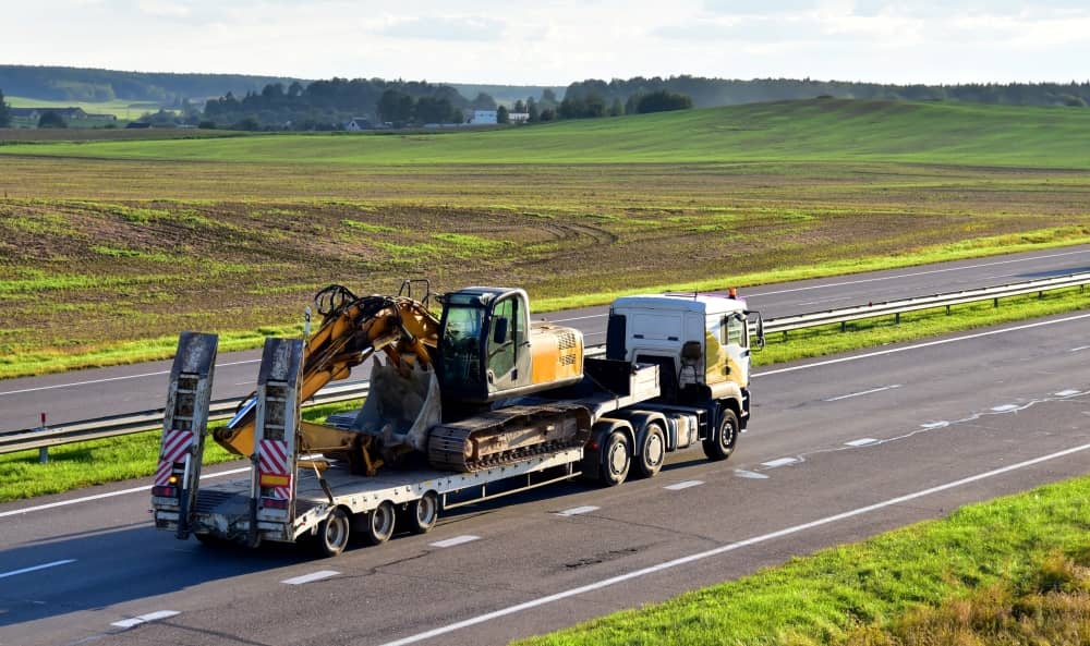 Drop decks with ramps consist of a flatbed connected to a trailer with the floor lowered close to the ground and a ramp for easy access.