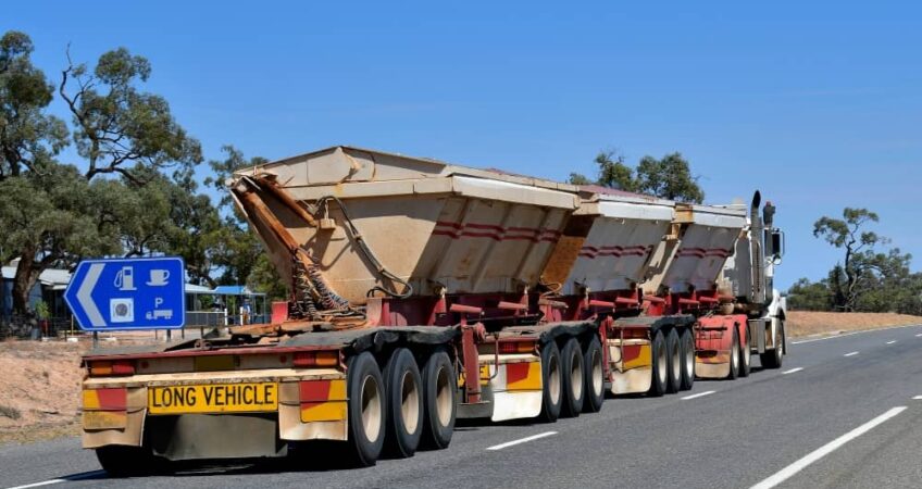 Trailers range from smaller flatbeds to large semi-trailers.