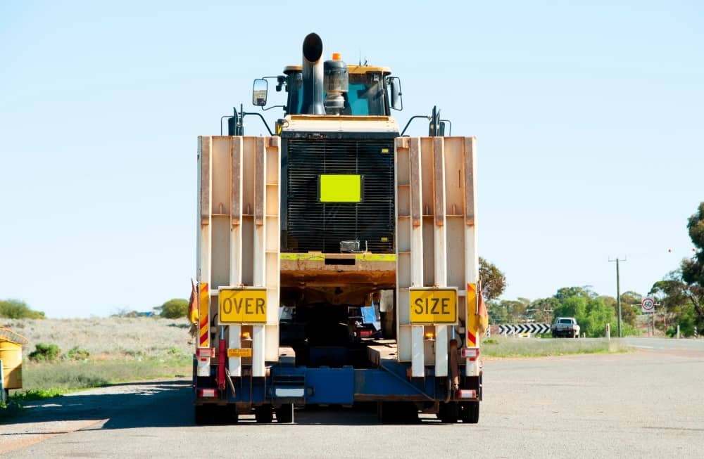 Select a flat, stable, and secure area for unloading, away from traffic and obstacles.